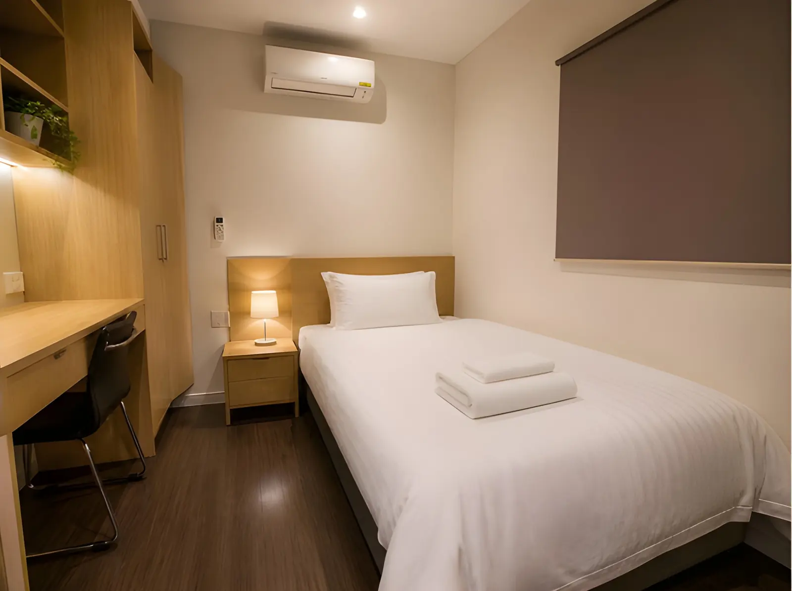 Clean single room in a camp cabin with fresh linen