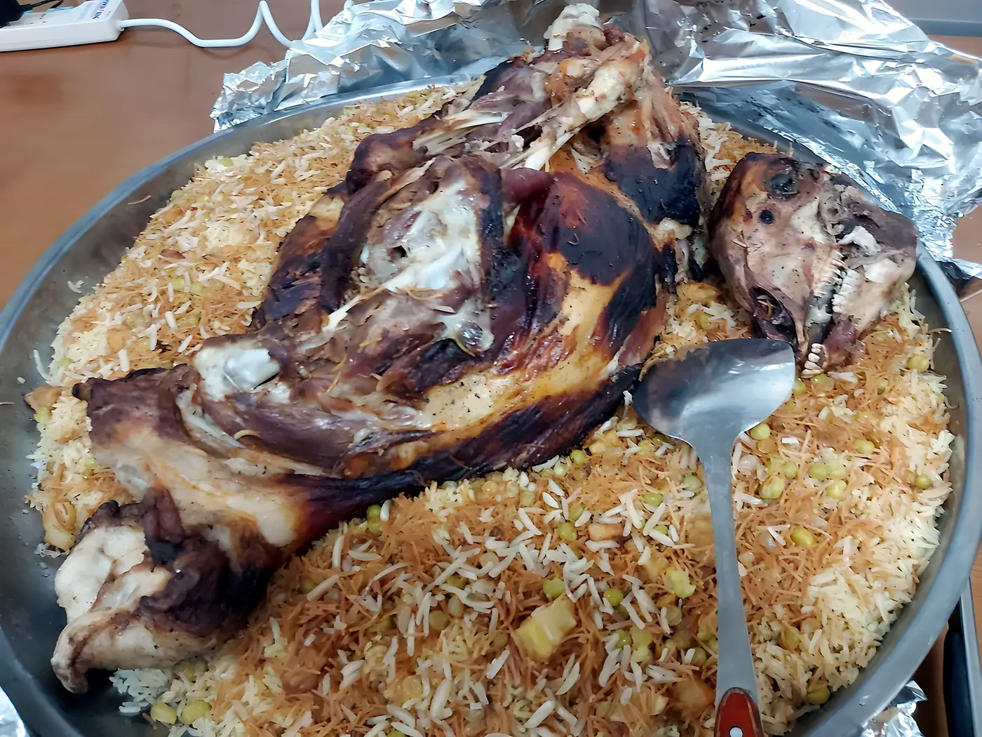 Quzi, slow-roasted lamb on rice, prepared by NANCO